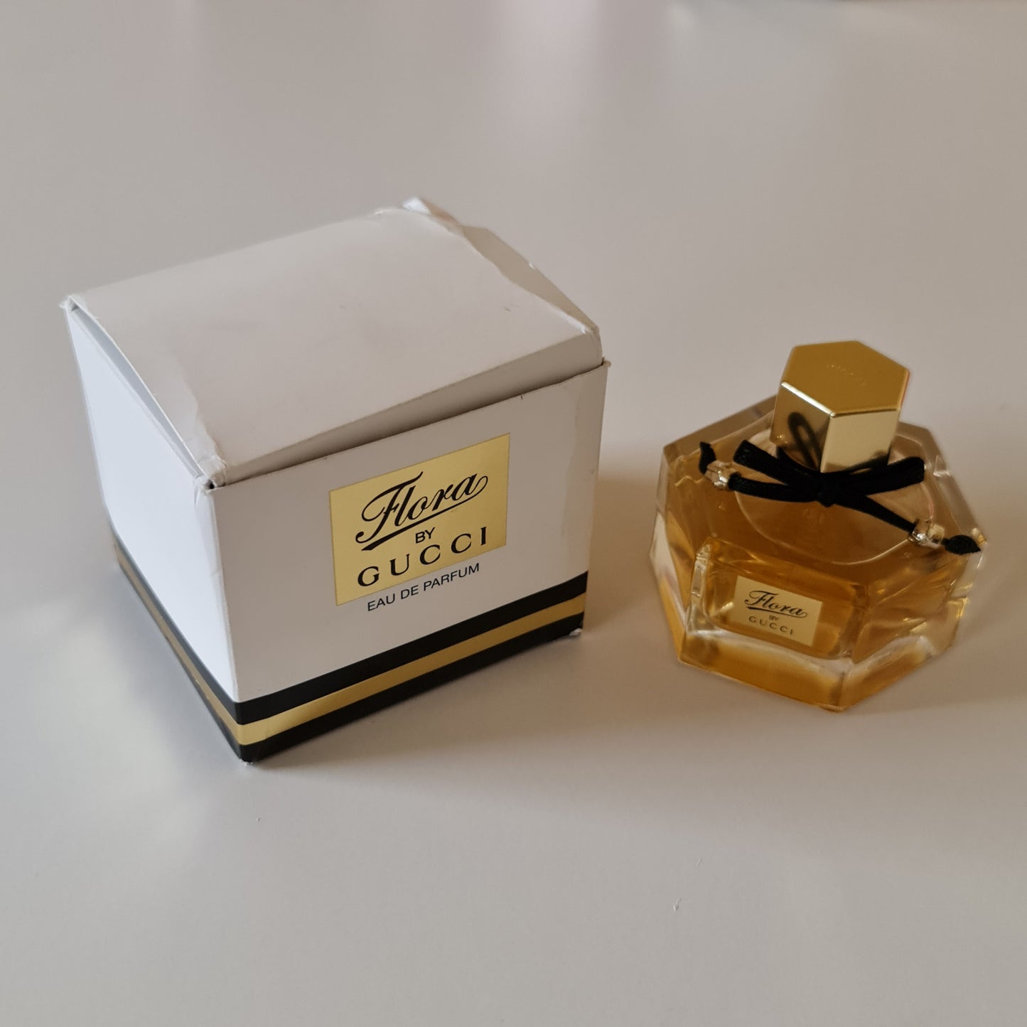 Gucci Flora Eau de Parfum 50ml. Front angled photo of bottle and box. Perfume, scent, fragrance and cologne.