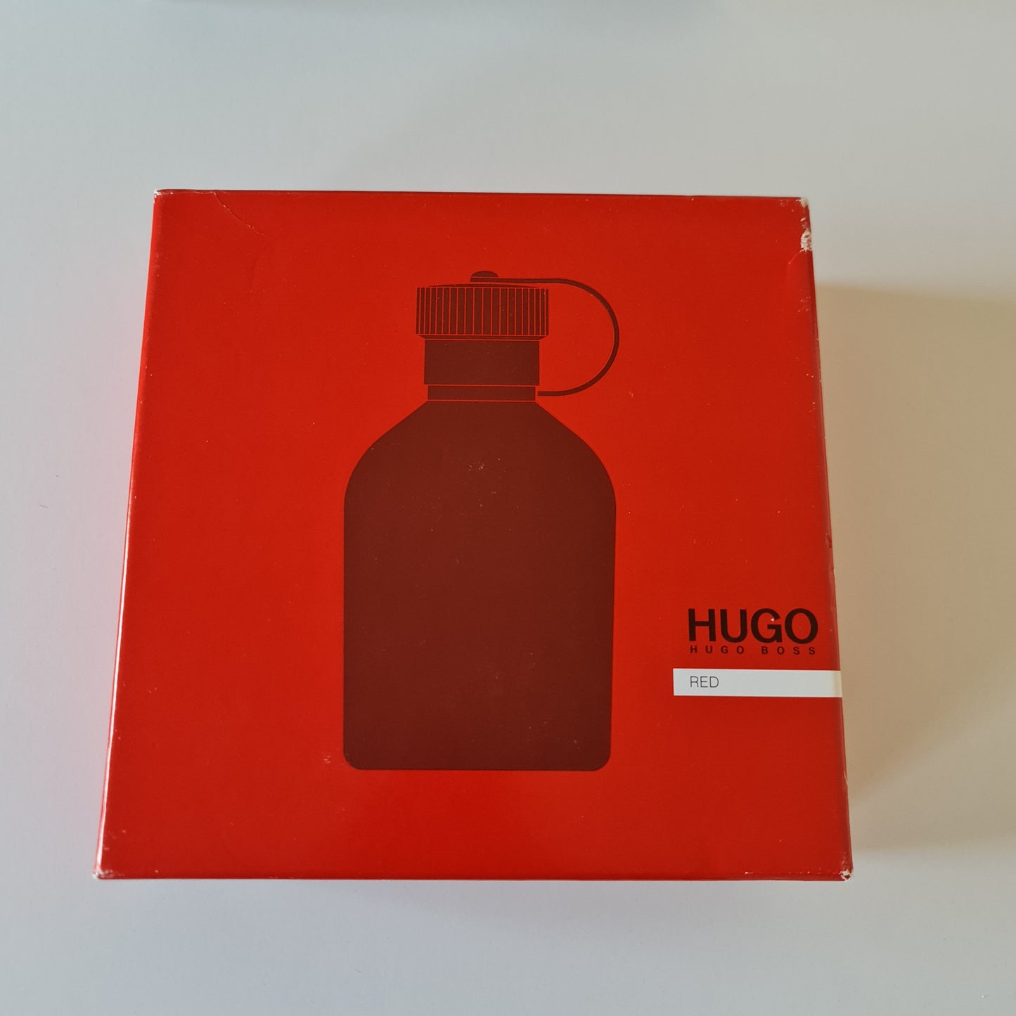 Hugo Boss Red Eau de Toilette 75ml gift set. Photo showing damaged front of box. Perfume, fragrance, cologne and scent.