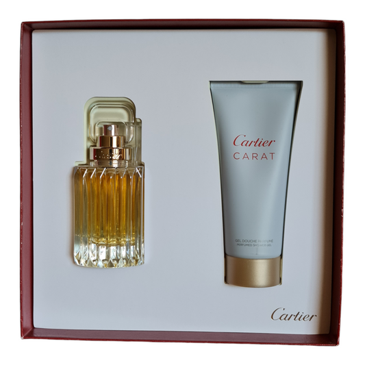 Front angled photo of inside of gift box, showing perfume bottle and shower gel.