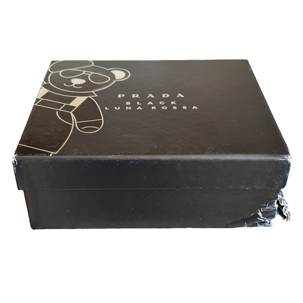 Photo showing imperfection and top of perfume gift box.