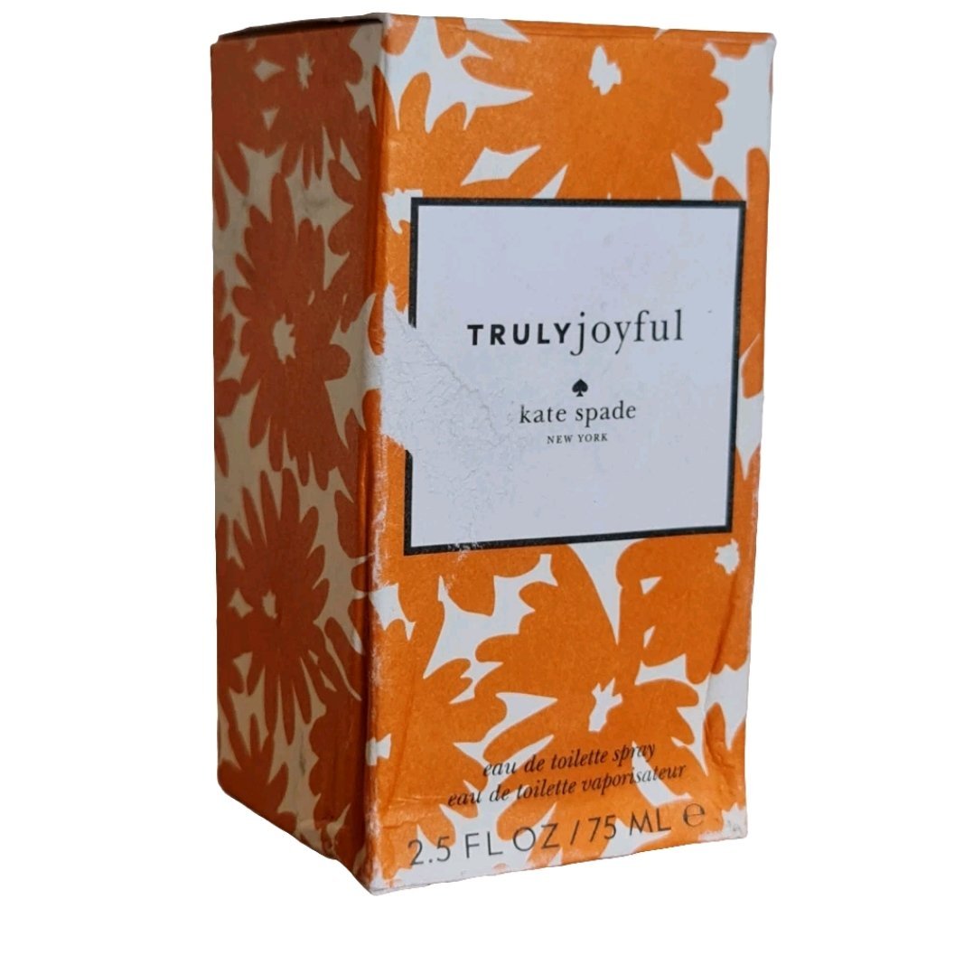 Kate Spade Truly Joyful Eau de Toilette 75ml Kate Spade Truly Joyful Eau de Toilette 75ml. Orange perfume box at a angle.